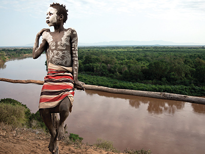 Young Karo boy at the Omo river - Guillaume Petermann